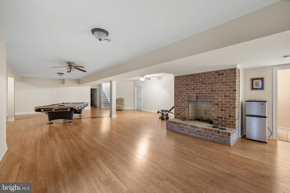 Billiard Table, Fireplace, Game Room, Interior, Stone Walls, Wood Texture Flooring