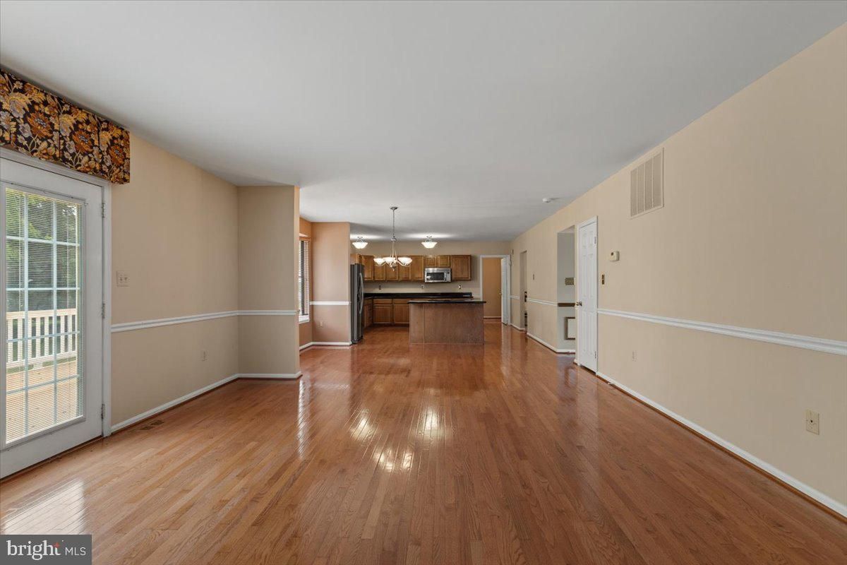 Empty room, Interior, Kitchen, Stainless Steel Appliances, Wood Texture Flooring