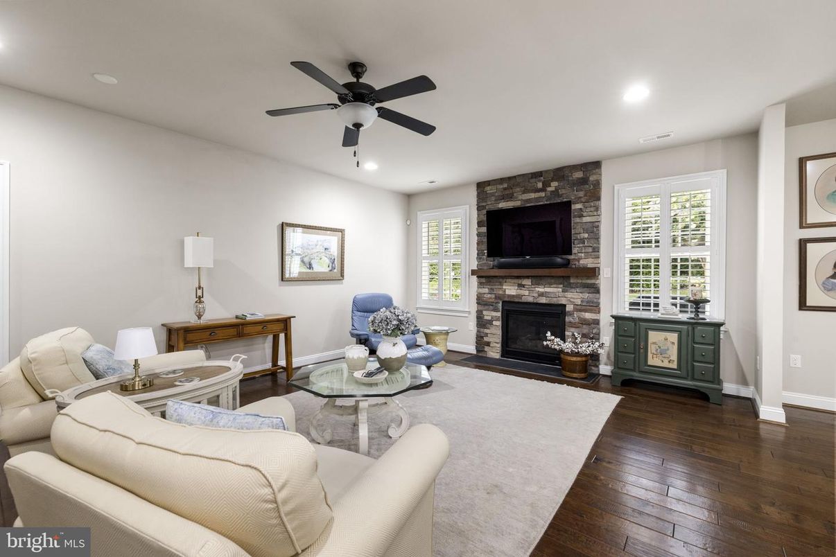 Fireplace, Interior, Living room, Recessed Lighting, Stone Walls, Wood Texture Flooring