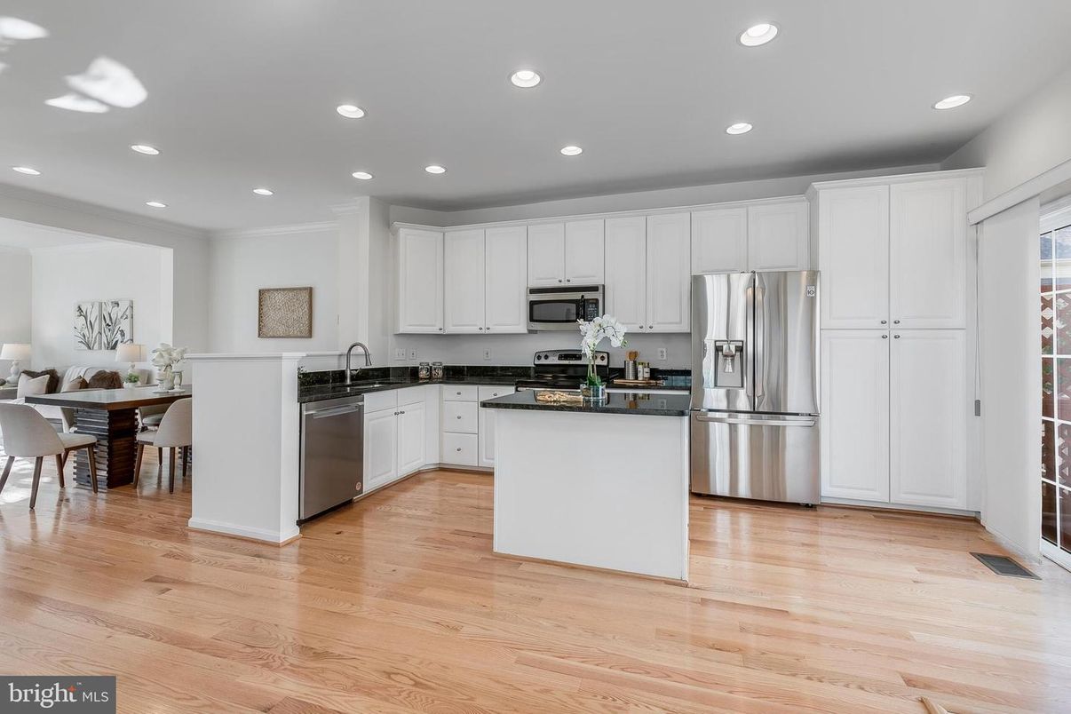 Dining room, Interior, Kitchen, Recessed Lighting, Stainless Steel Appliances, Wood Texture Flooring