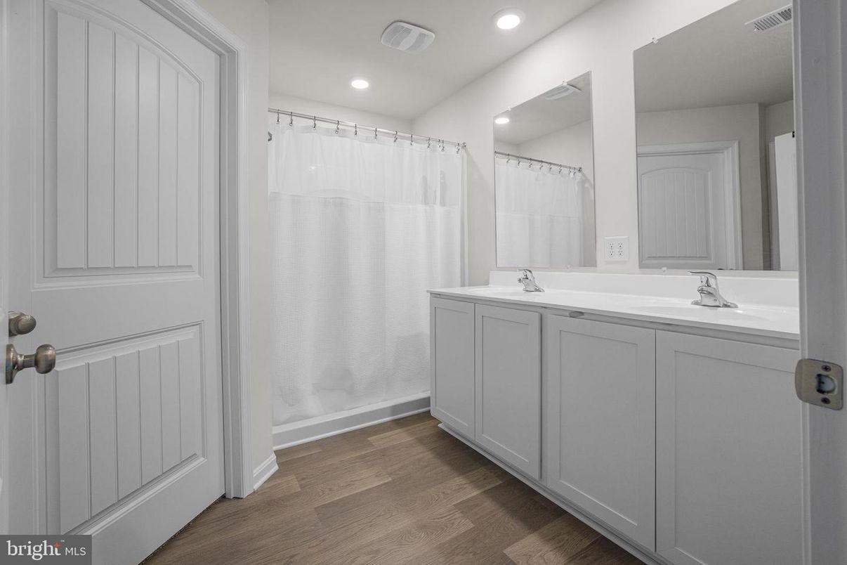 Bathroom, Dual Sink Vanities, Interior, Recessed Lighting, Wood Texture Flooring