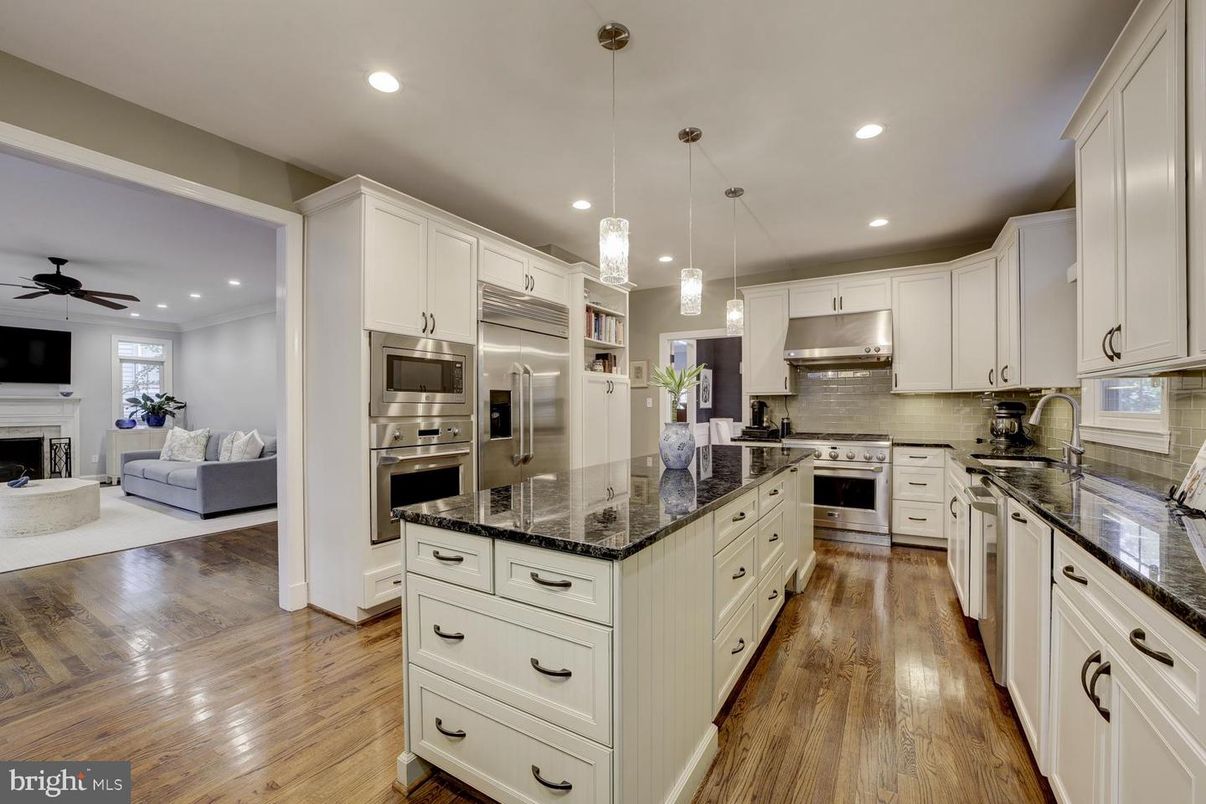 Fireplace, Interior, Kitchen, Living room, Pendant Lights, Recessed Lighting, Stainless Steel Appliances, Wood Texture Flooring