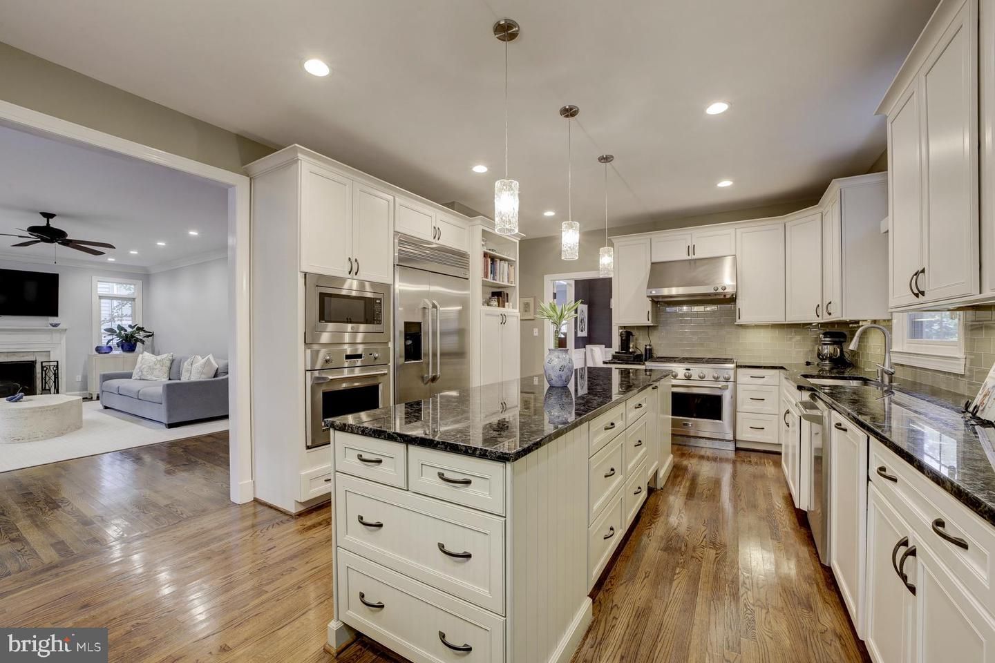 Fireplace, Interior, Kitchen, Living room, Pendant Lights, Recessed Lighting, Stainless Steel Appliances, Wood Texture Flooring