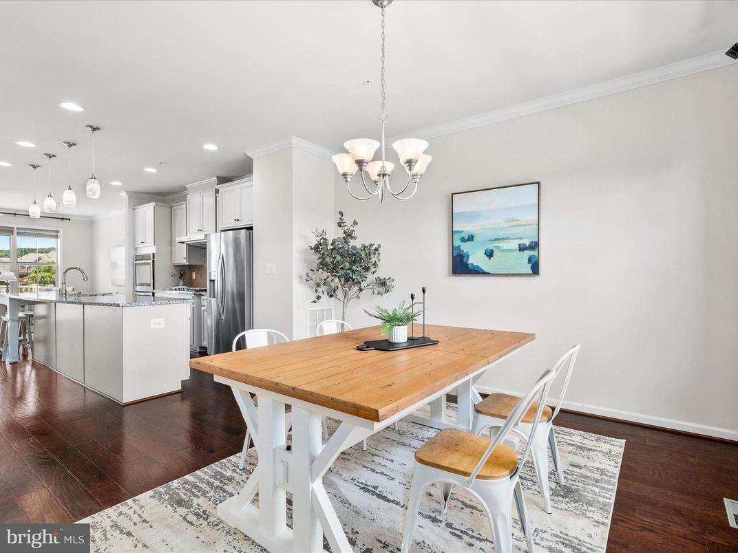 Chandelier, Dining room, Interior, Kitchen, Pendant Lights, Recessed Lighting, Stainless Steel Appliances, Wood Texture Flooring