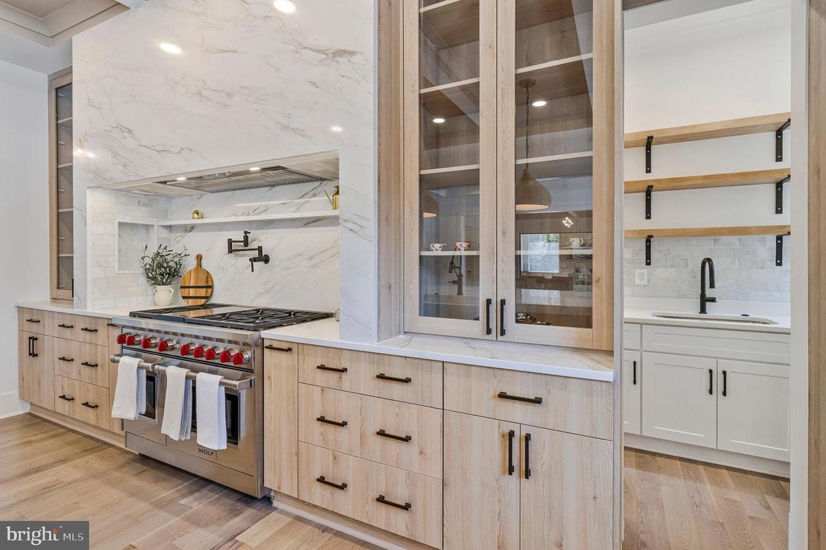 Interior, Kitchen, Marble Walls, Recessed Lighting, Stainless Steel Appliances, Wood Texture Flooring