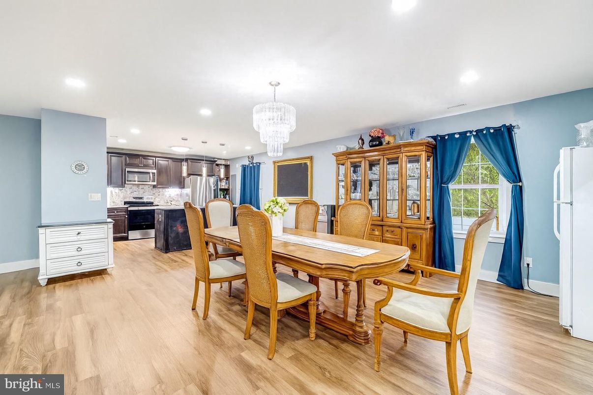 Chandelier, Dining room, Interior, Kitchen, Recessed Lighting, Stainless Steel Appliances, Wood Texture Flooring