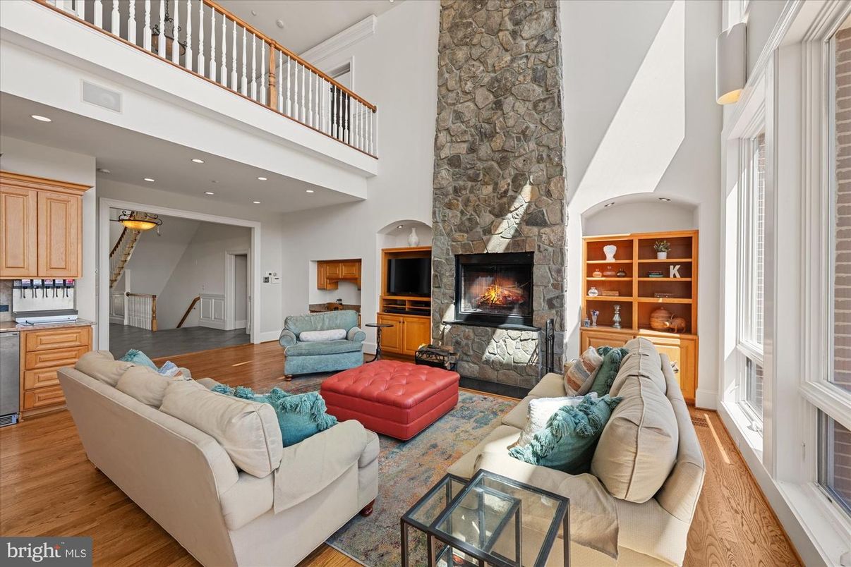 Fireplace, Interior, Living room, Recessed Lighting, Stone Walls, Wood Texture Flooring