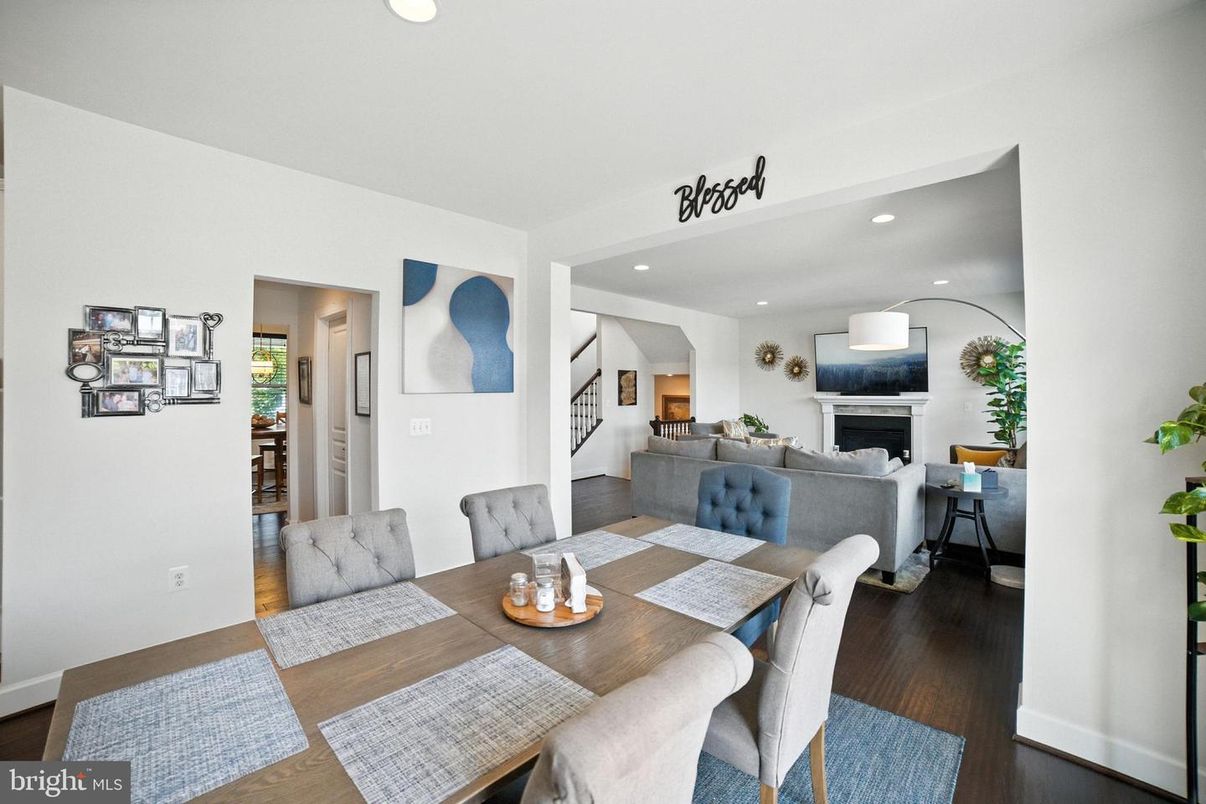 Dining room, Fireplace, Interior, Living room, Recessed Lighting, Wood Texture Flooring