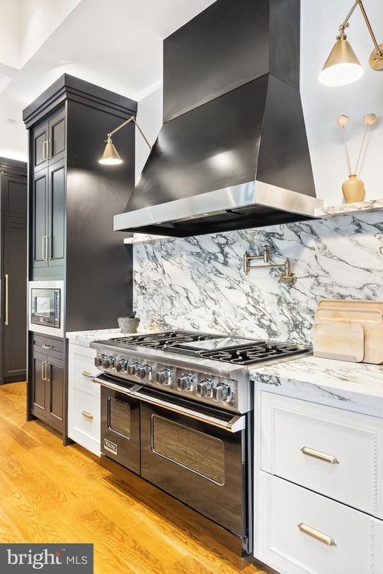 Interior, Kitchen, Marble Walls, Pendant Lights, Stainless Steel Appliances, Wood Texture Flooring