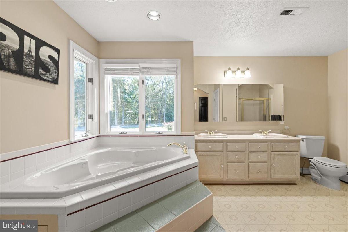 Bathroom, Dual Sink Vanities, Interior, Recessed Lighting, Tile Countertops