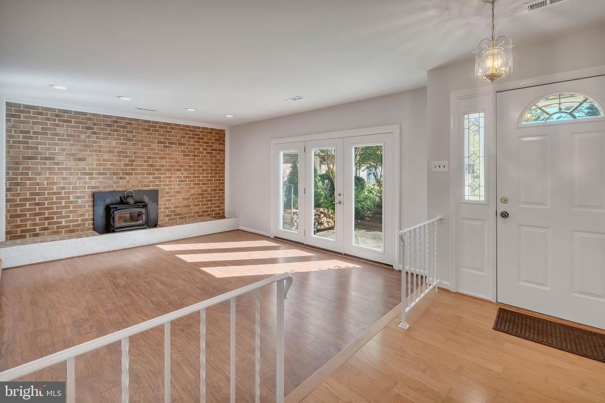 Empty room, Fireplace, Interior, Pendant Lights, Recessed Lighting, Stone Walls, Wood Texture Flooring