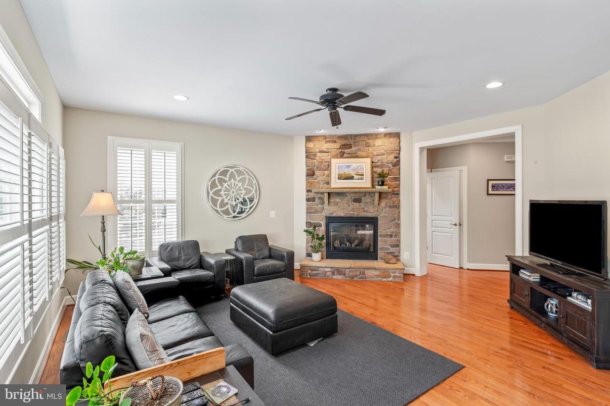 Fireplace, Interior, Living room, Recessed Lighting, Stone Walls, Wood Texture Flooring