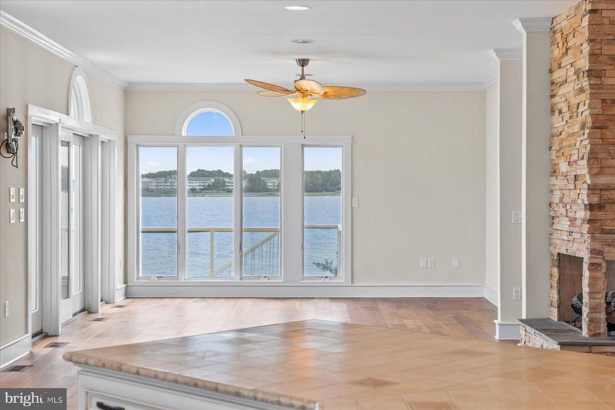 Empty room, Fireplace, Interior, Recessed Lighting, Water, Wood Texture Flooring