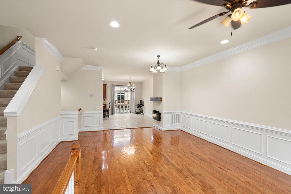 Chandelier, Dining room, Empty room, Fireplace, Interior, Recessed Lighting, Wood Texture Flooring