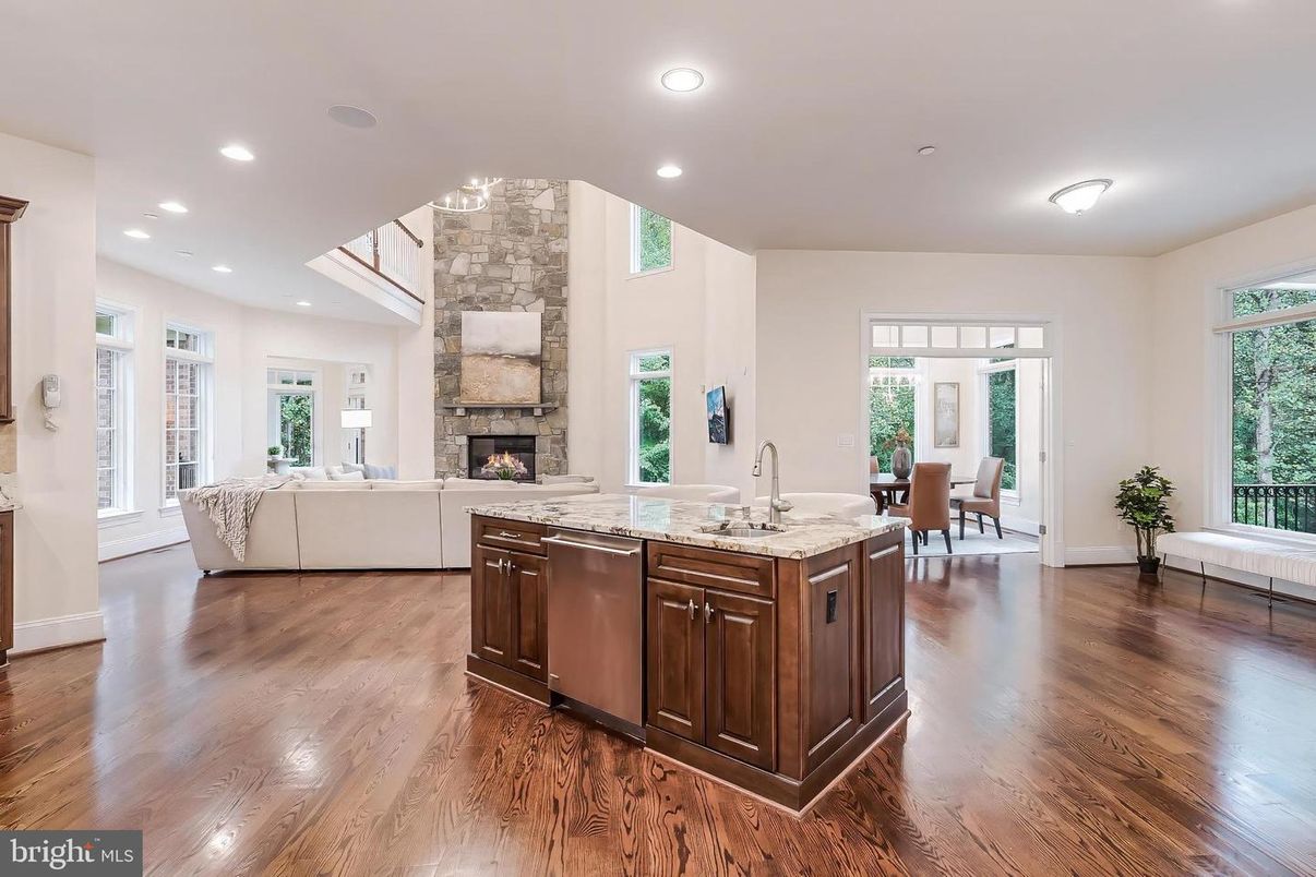 Dining room, Fireplace, Interior, Kitchen, Living room, Recessed Lighting, Stone Walls, Wood Texture Flooring