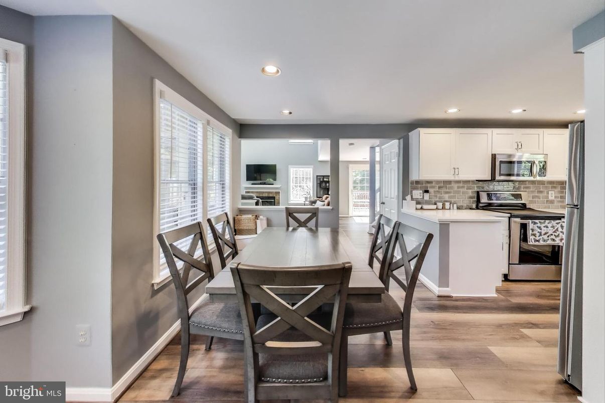 Dining room, Interior, Kitchen, Recessed Lighting, Stainless Steel Appliances, Wood Texture Flooring