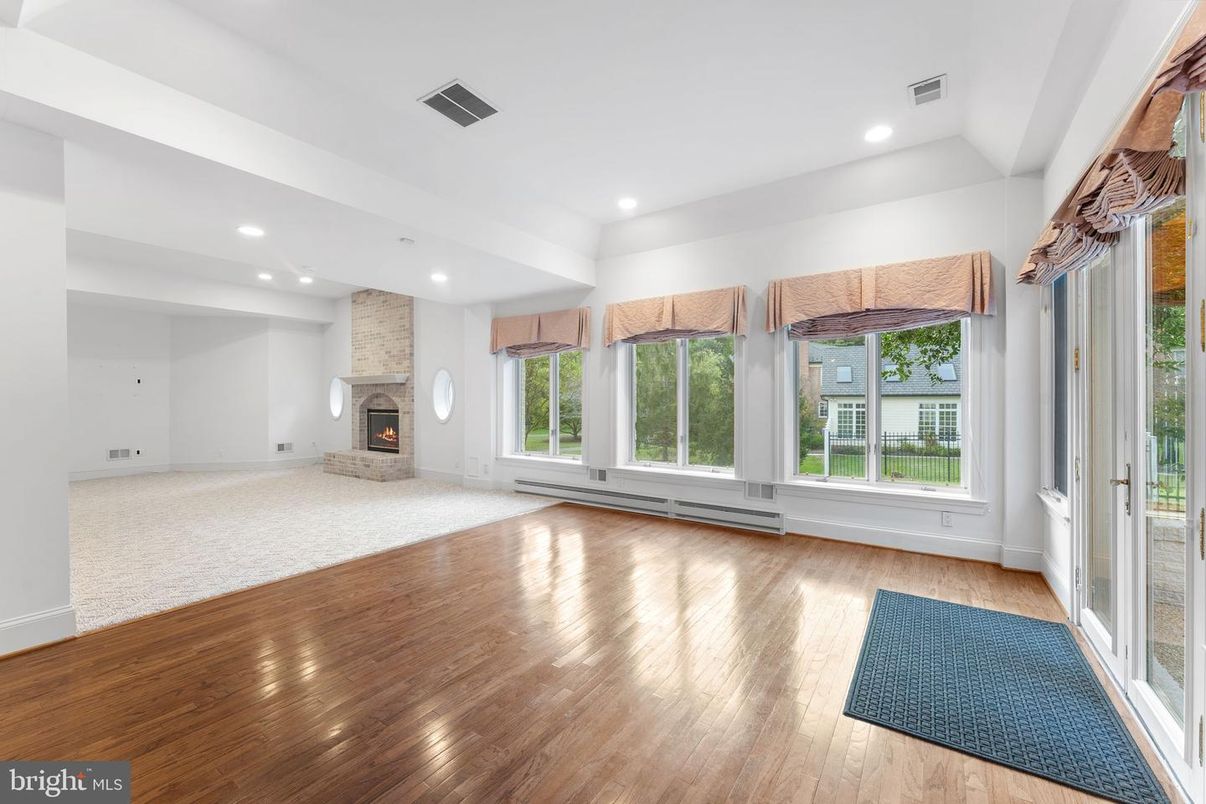 Empty room, Fireplace, Interior, Recessed Lighting, Stone Walls, Wood Texture Flooring