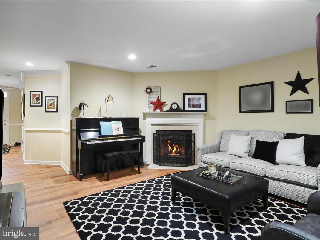 Fireplace, Interior, Living room, Piano, Recessed Lighting, Wood Texture Flooring