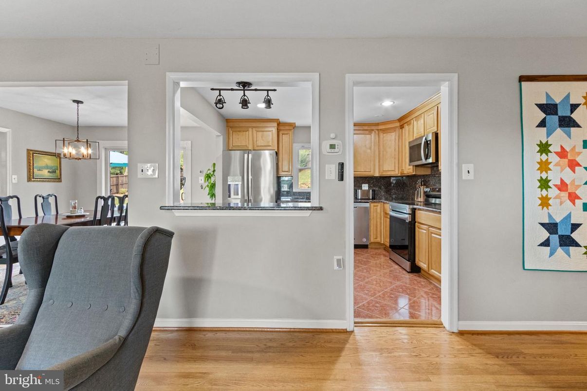 Chandelier, Dining room, Interior, Kitchen, Pendant Lights, Stainless Steel Appliances, Wood Texture Flooring