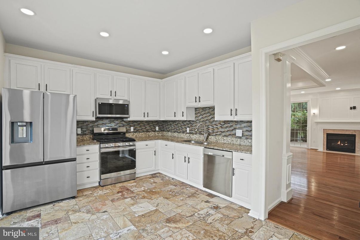 Fireplace, Interior, Kitchen, Recessed Lighting, Stainless Steel Appliances, Wood Texture Flooring