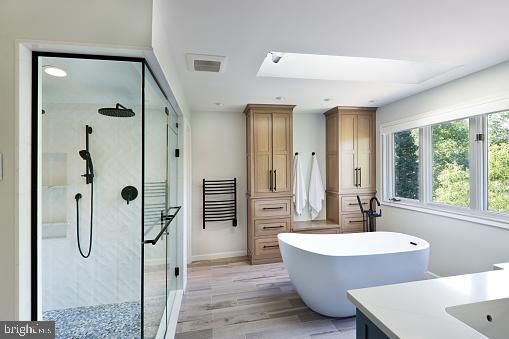 Bathroom, Dual Sink Vanities, Free Standing Baths, Glass Shower, Interior, Recessed Lighting, Wood Texture Flooring