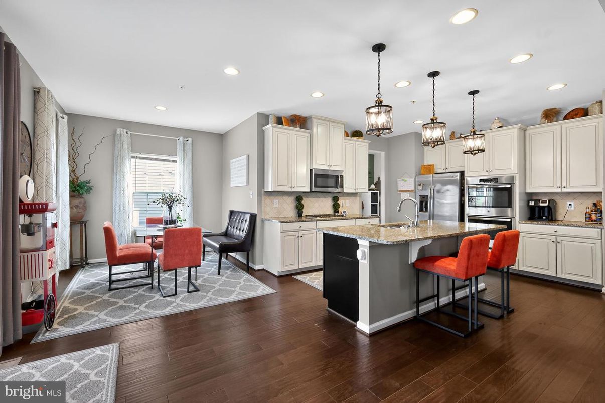 Dining room, Interior, Kitchen, Pendant Lights, Recessed Lighting, Stainless Steel Appliances, Wood Texture Flooring