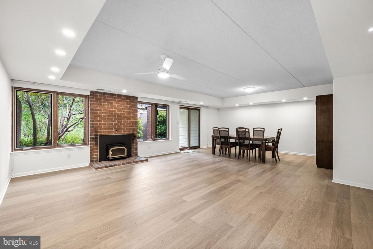Dining room, Fireplace, Interior, Recessed Lighting, Stone Walls, Wood Texture Flooring