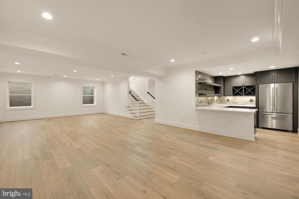 Empty room, Interior, Kitchen, Recessed Lighting, Stainless Steel Appliances, Wood Texture Flooring