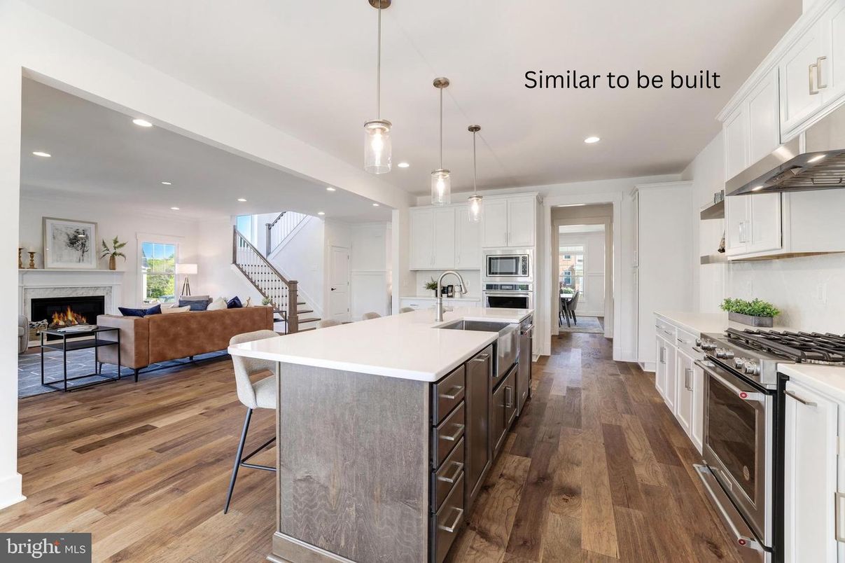 Fireplace, Interior, Kitchen, Living room, Pendant Lights, Recessed Lighting, Stainless Steel Appliances, Wood Texture Flooring