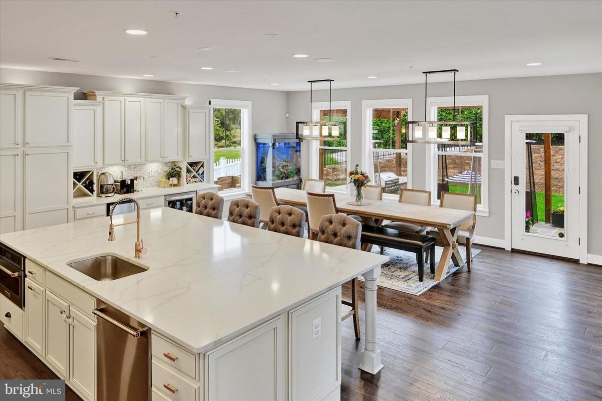 Dining room, Interior, Kitchen, Pendant Lights, Recessed Lighting, Stainless Steel Appliances, Wood Texture Flooring