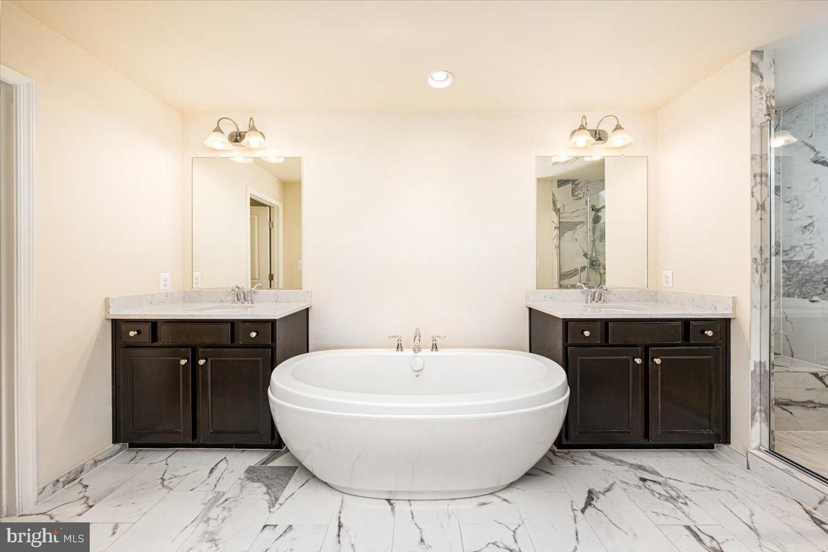 Bathroom, Dual Sink Vanities, Free Standing Baths, Interior, Marble, Marble Walls, Recessed Lighting