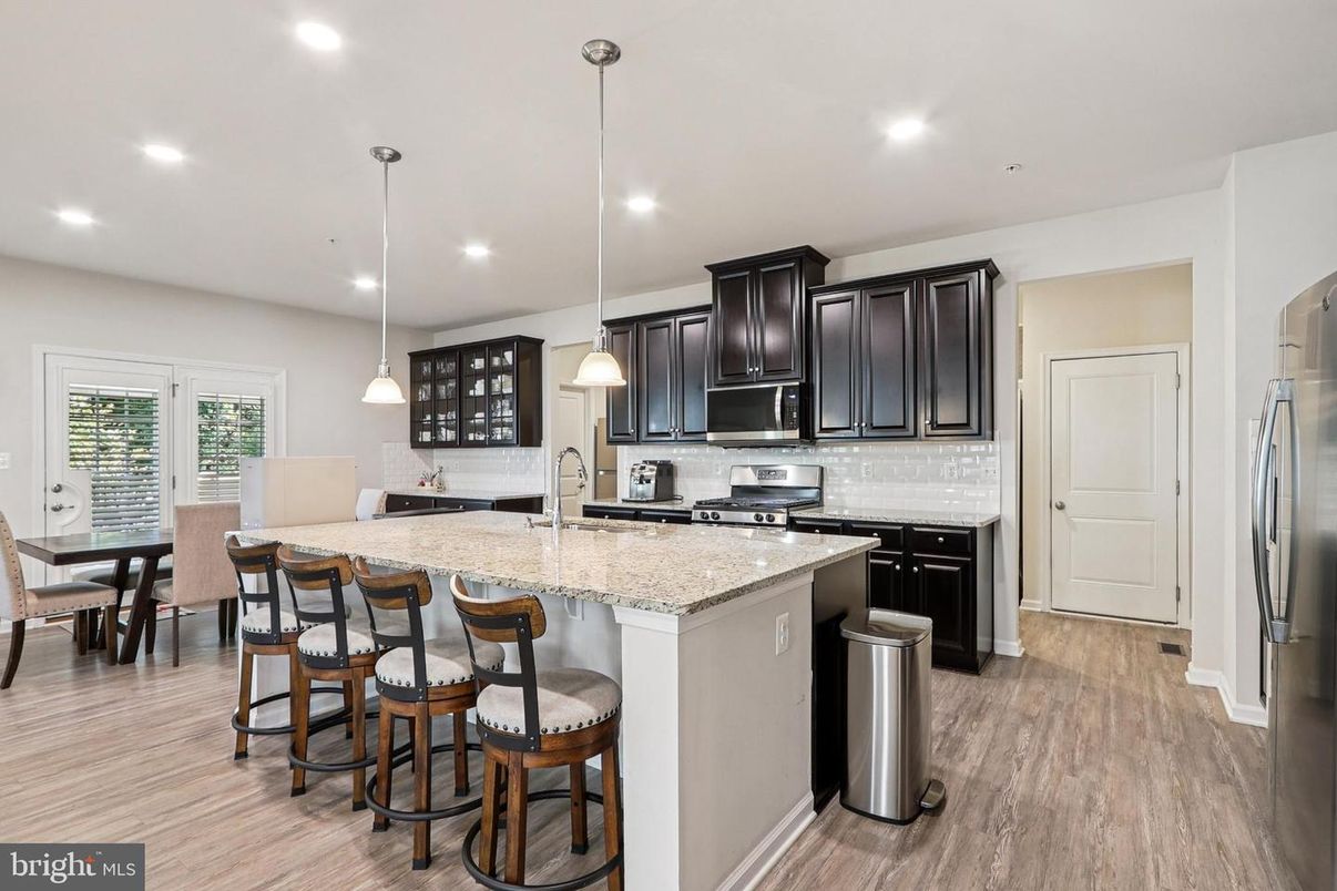 Dining room, Interior, Kitchen, Pendant Lights, Recessed Lighting, Stainless Steel Appliances, Wood Texture Flooring