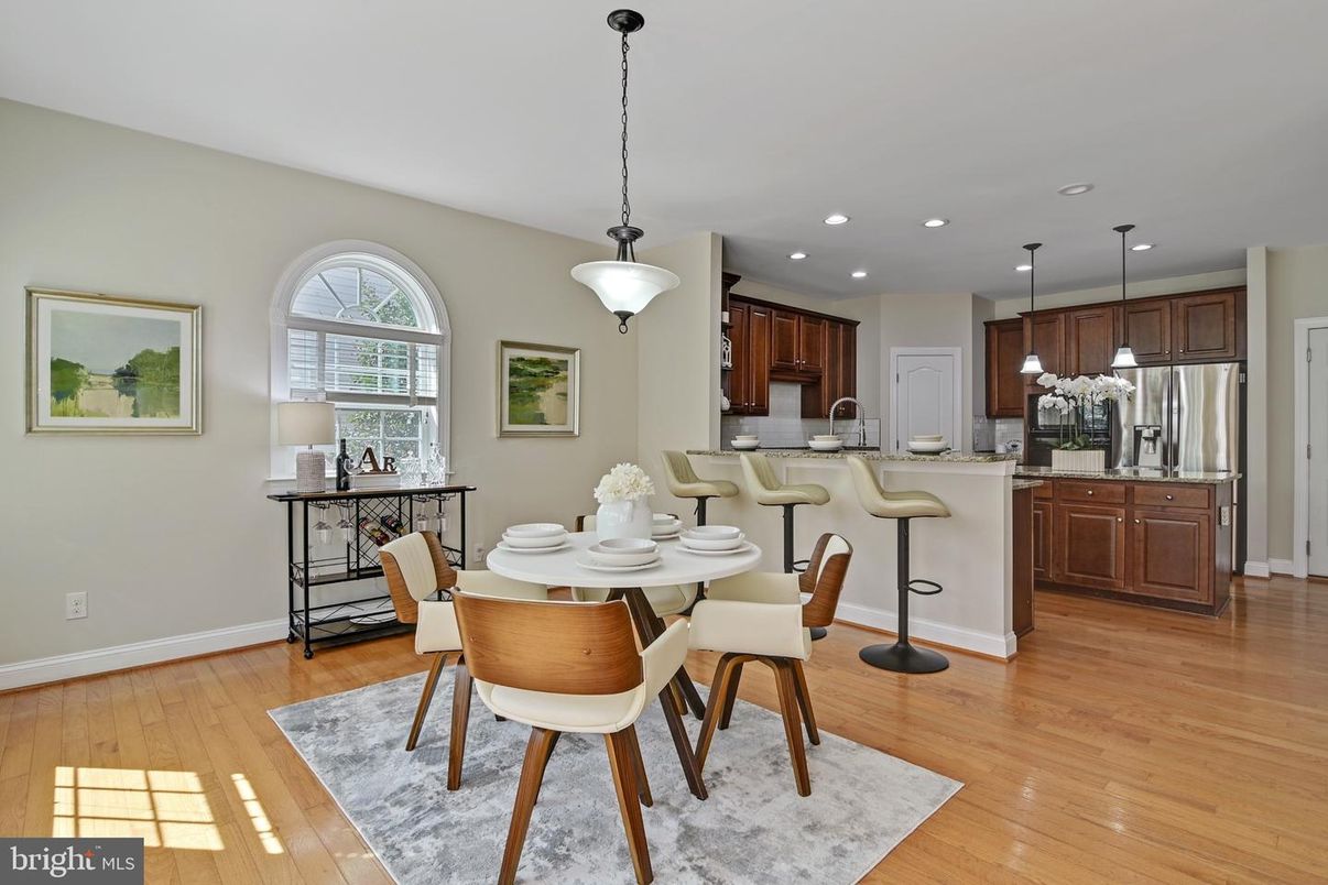 Dining room, Interior, Kitchen, Pendant Lights, Recessed Lighting, Stainless Steel Appliances, Wood Texture Flooring