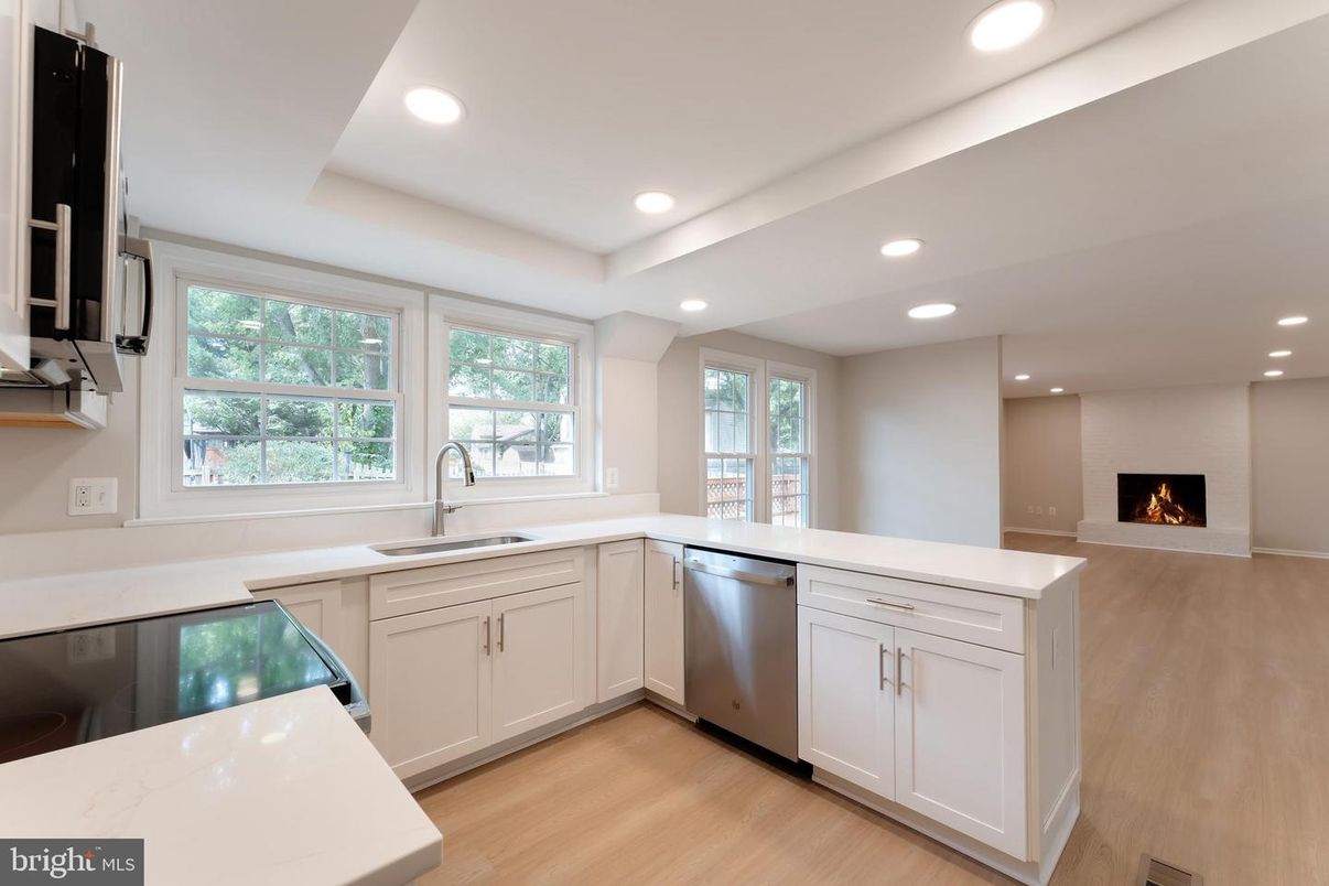 Fireplace, Interior, Kitchen, Recessed Lighting, Stainless Steel Appliances, Wood Texture Flooring