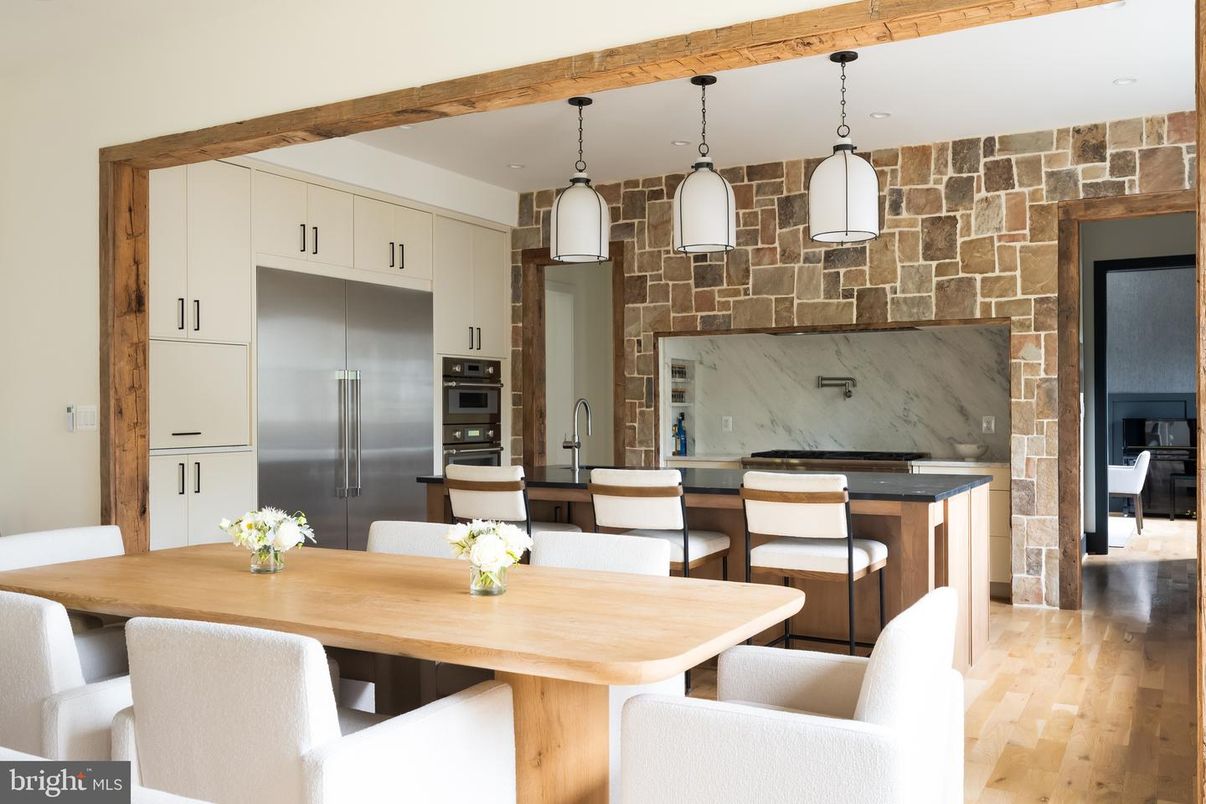 Dining room, Interior, Kitchen, Pendant Lights, Stainless Steel Appliances, Stone Walls, Wood Texture Flooring