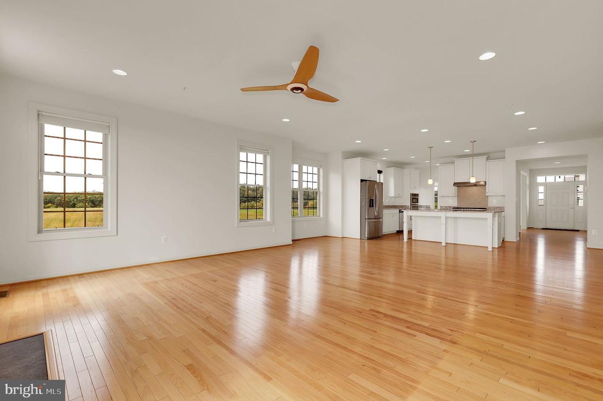Empty room, Interior, Kitchen, Pendant Lights, Recessed Lighting, Stainless Steel Appliances, Wood Texture Flooring