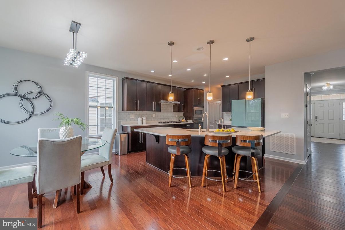 Dining room, Interior, Kitchen, Pendant Lights, Recessed Lighting, Stainless Steel Appliances, Wood Texture Flooring