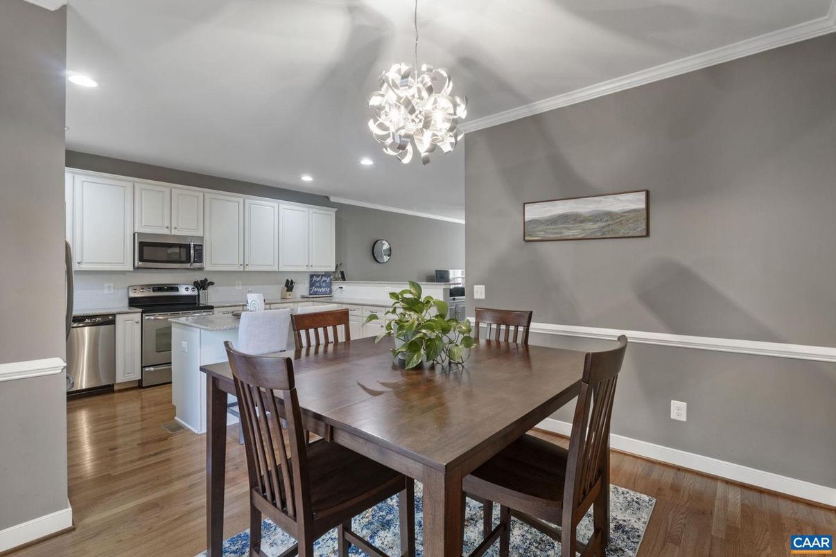 Chandelier, Dining room, Interior, Kitchen, Pendant Lights, Recessed Lighting, Stainless Steel Appliances, Wood Texture Flooring