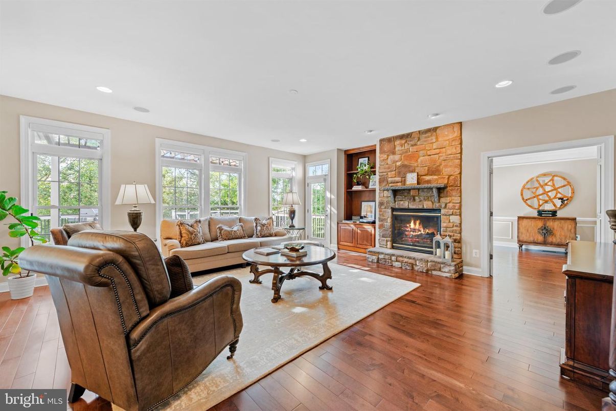 Fireplace, Interior, Living room, Recessed Lighting, Stone Walls, Wood Texture Flooring