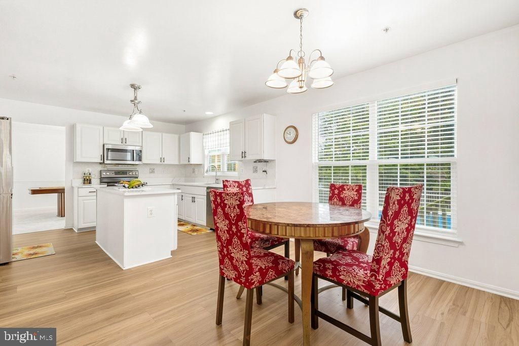 Chandelier, Dining room, Interior, Kitchen, Recessed Lighting, Stainless Steel Appliances, Wood Texture Flooring
