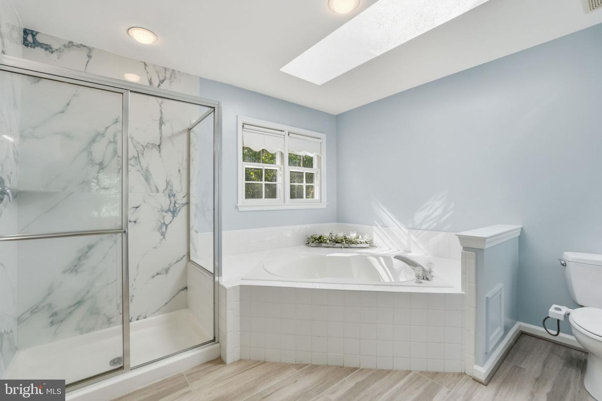 Bathroom, Glass Shower, Interior, Marble Walls, Recessed Lighting, Wood Texture Flooring