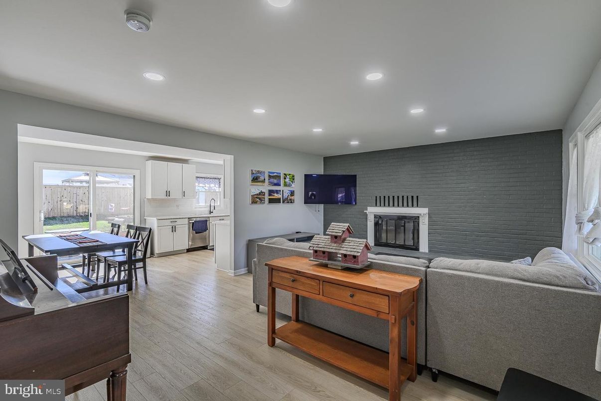 Dining room, Fireplace, Interior, Kitchen, Living room, Recessed Lighting, Stone Walls, Wood Texture Flooring