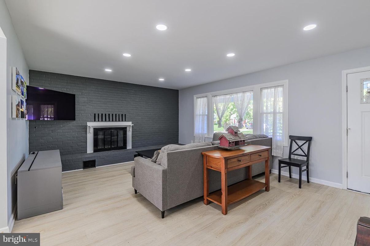 Fireplace, Interior, Living room, Recessed Lighting, Stone Walls, Wood Texture Flooring