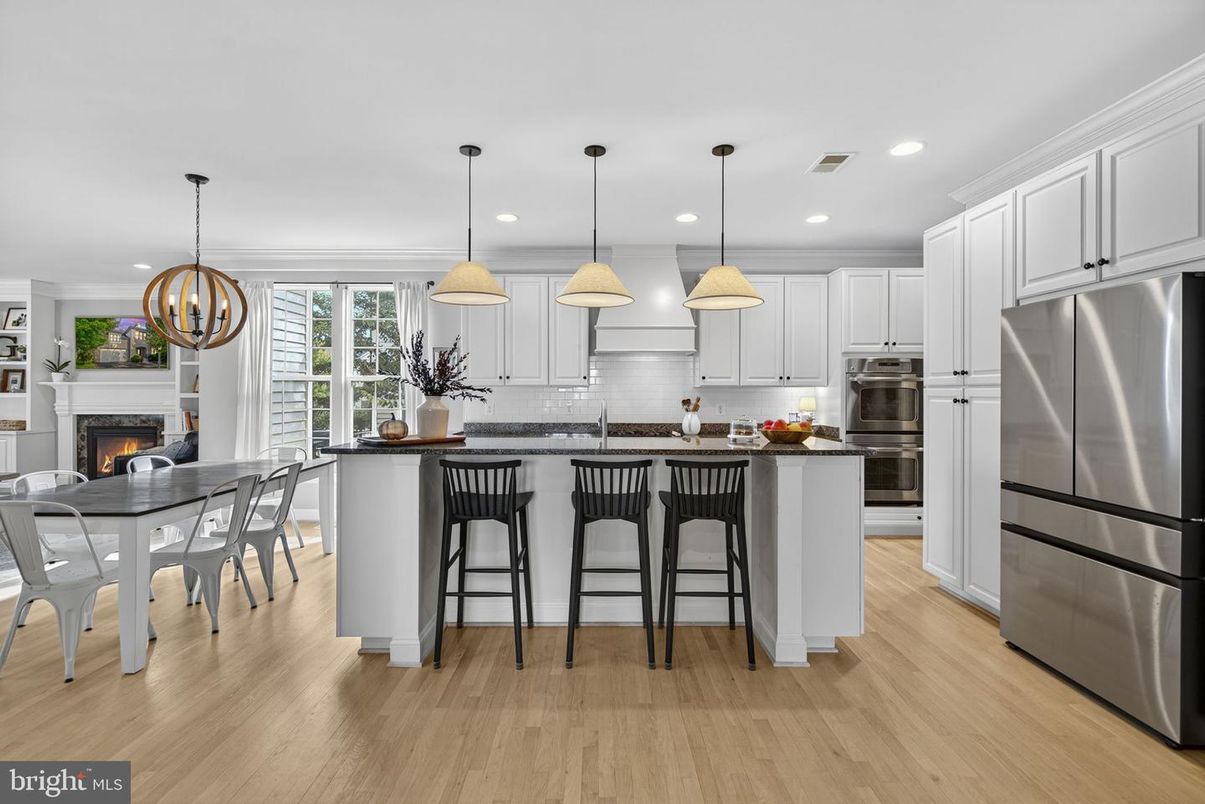 Dining room, Fireplace, Interior, Kitchen, Pendant Lights, Recessed Lighting, Stainless Steel Appliances, Wood Texture Flooring