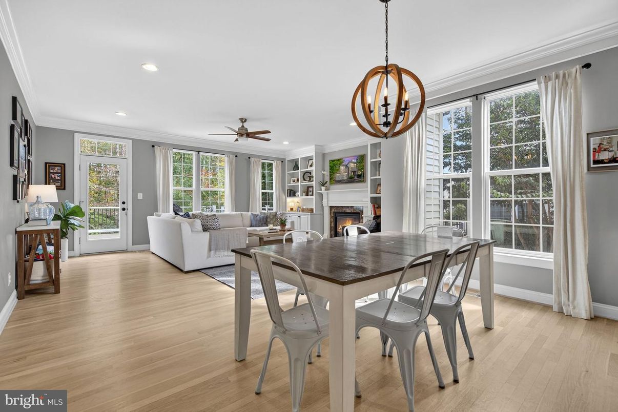 Chandelier, Dining room, Fireplace, Interior, Living room, Pendant Lights, Recessed Lighting, Wood Texture Flooring