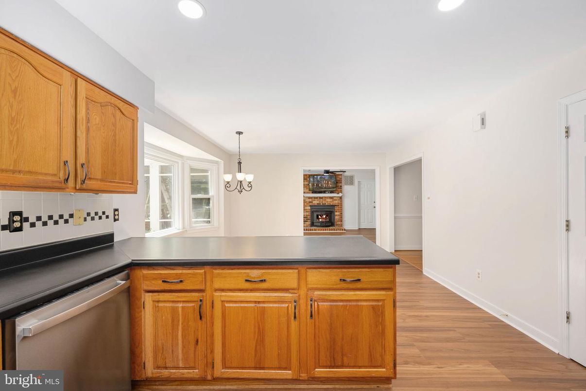 Chandelier, Fireplace, Interior, Kitchen, Recessed Lighting, Wood Texture Flooring