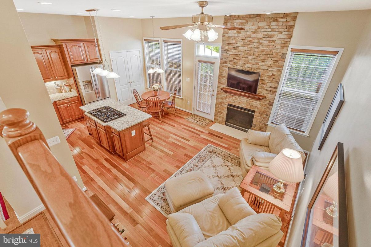 Dining room, Fireplace, Interior, Kitchen, Living room, Recessed Lighting, Stone Walls, Wood Texture Flooring
