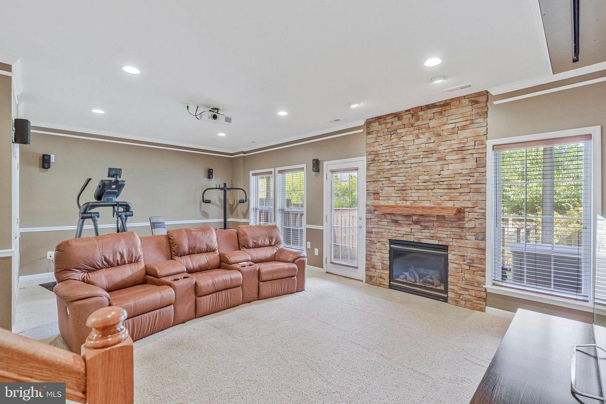 Fireplace, Fitness Equipment, Interior, Living room, Recessed Lighting, Stone Walls