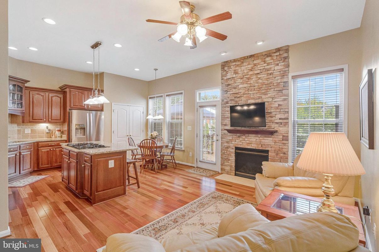 Dining room, Fireplace, Interior, Kitchen, Living room, Pendant Lights, Recessed Lighting, Stainless Steel Appliances, Stone Walls, Wood Texture Flooring