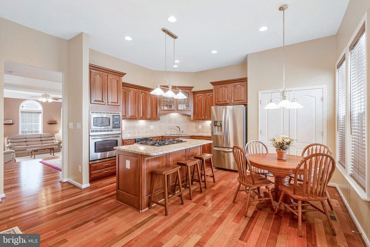 Dining room, Interior, Kitchen, Pendant Lights, Recessed Lighting, Stainless Steel Appliances, Wood Texture Flooring